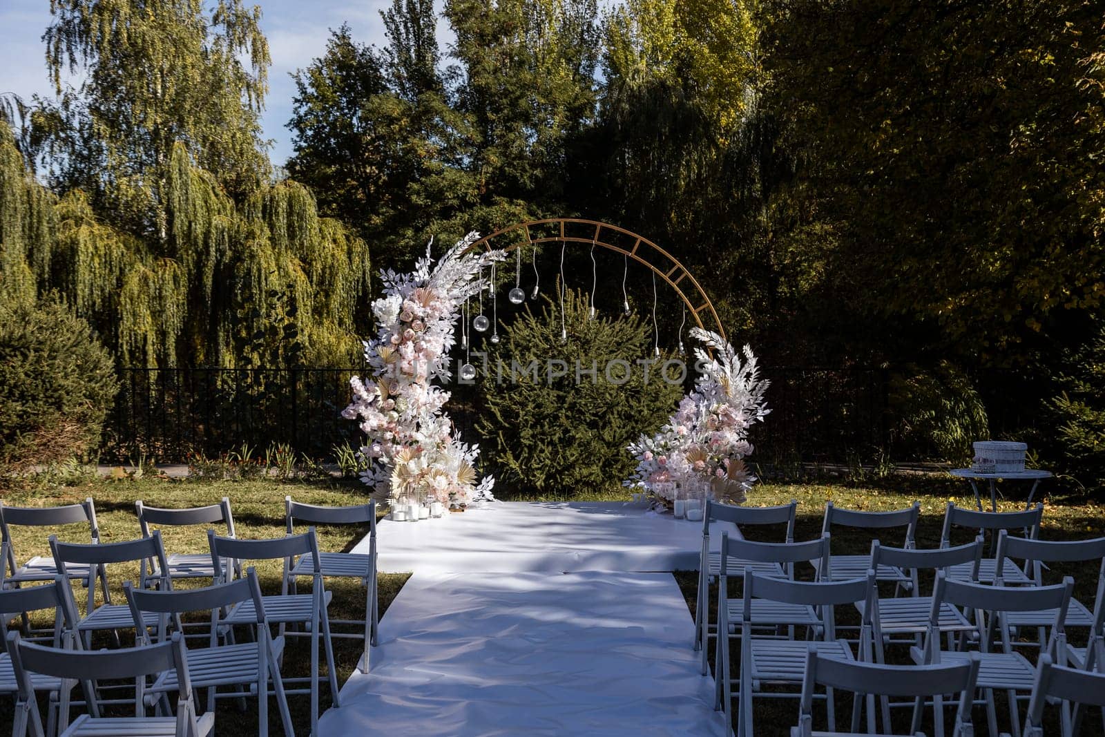 Festive arch for the ceremony of painting the newlyweds on the wedding day, wedding decor with fresh flowers by Dmitrytph