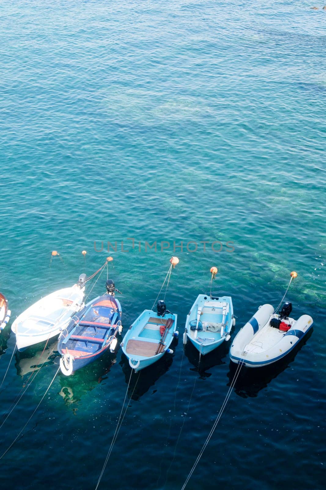 Small fishing boats moored in the harbour  by fotografiche.eu