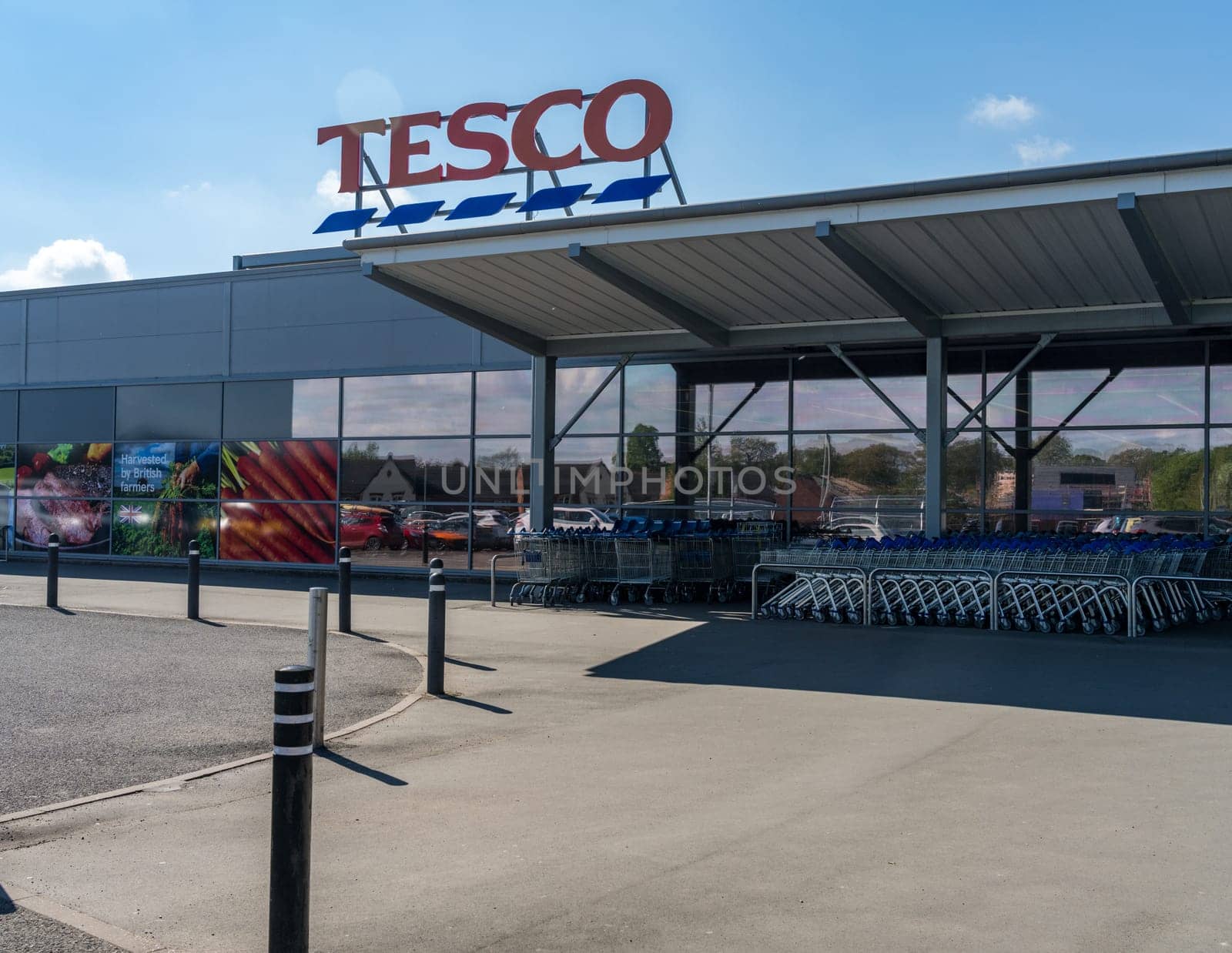 Ellesmere, Shropshire - 12 May 2023: Entrance to Tesco supermarket on sunny day in England