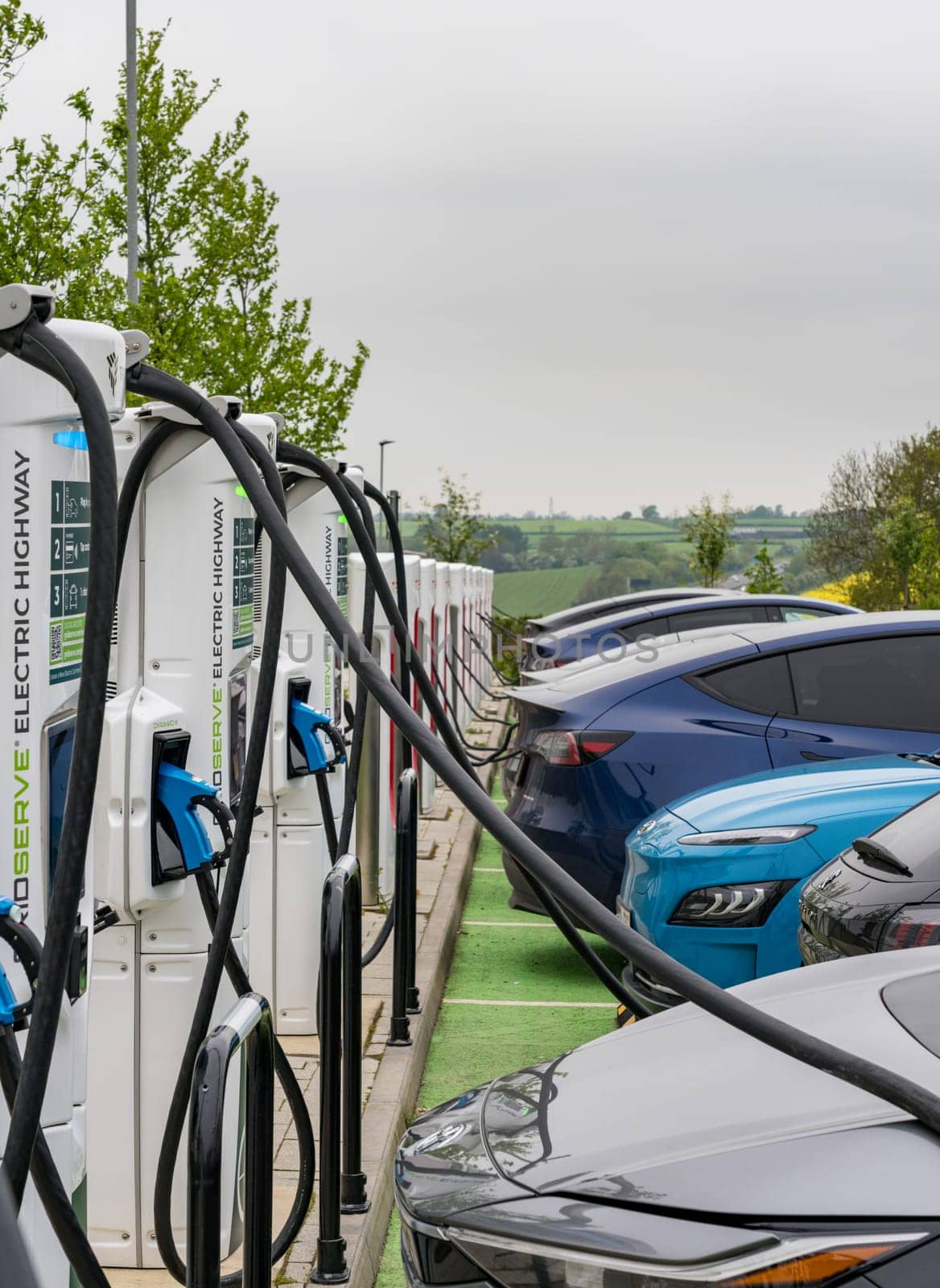 Tritium electric vehicle charging station on motorway in UK by steheap