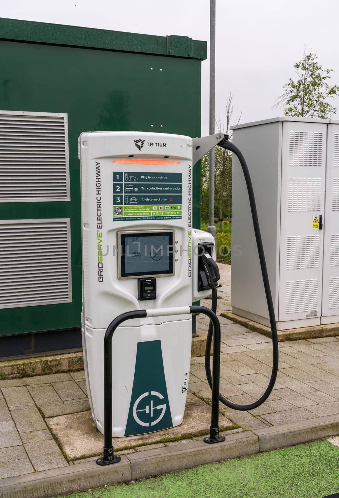 Tritium electric vehicle charging station on motorway in UK by steheap