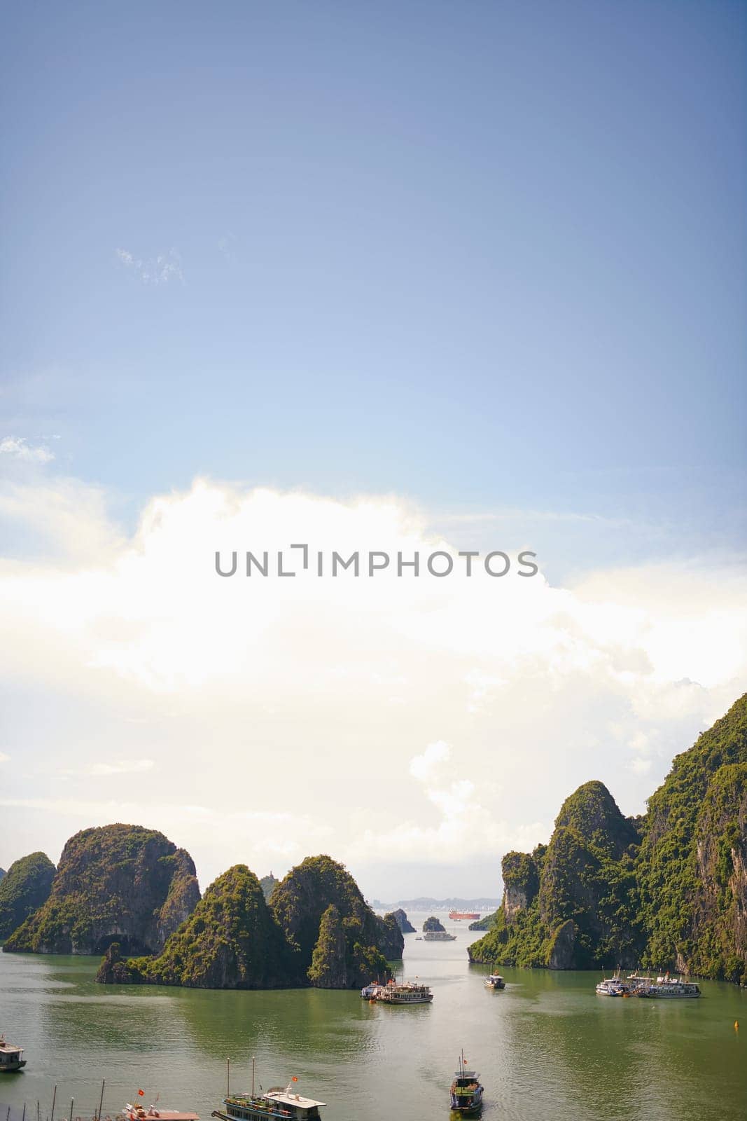 Inspiration for your travel bucket list. boats floating down a river in Vietnam. by YuriArcurs