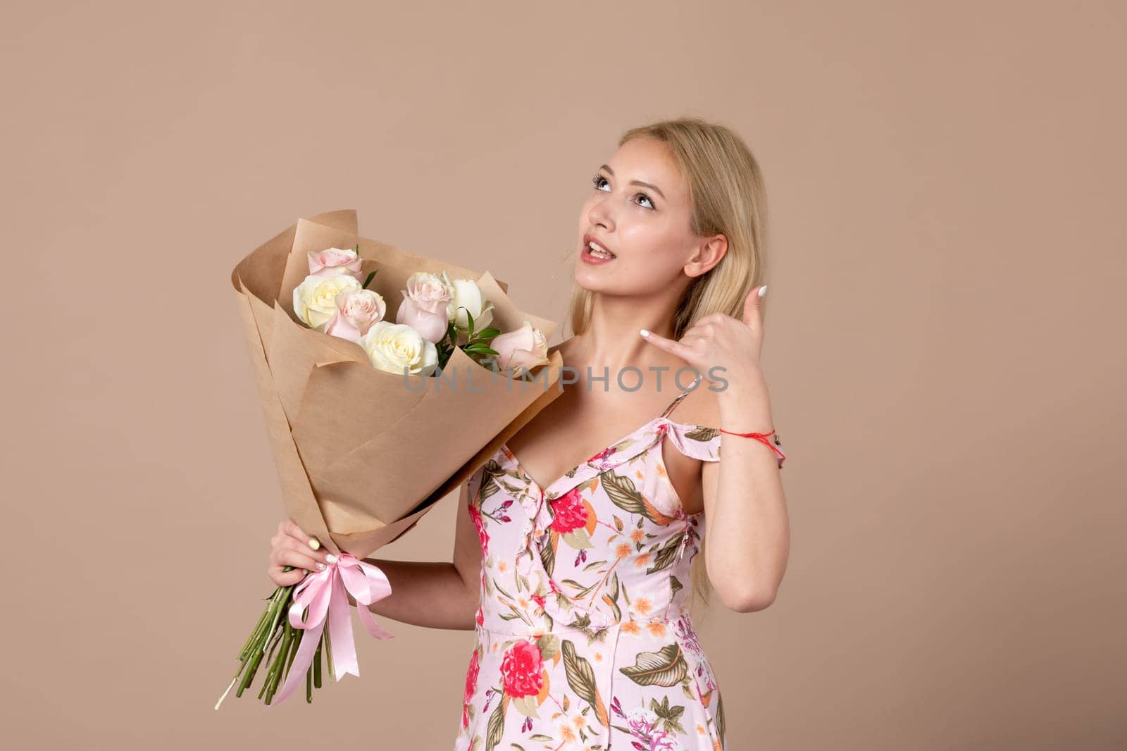front view young female posing with bouquet of beautiful roses on brown background feminine sensual woman horizontal march gift marriage by Kamran
