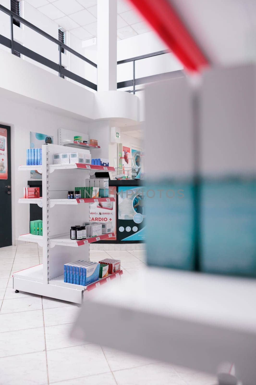 Drugstore shelves filled with pills and pharmaceutical products to sell prescription medicine or treatment to sick clients. Empty pharmacy with medication, supplements and drugs bottles.