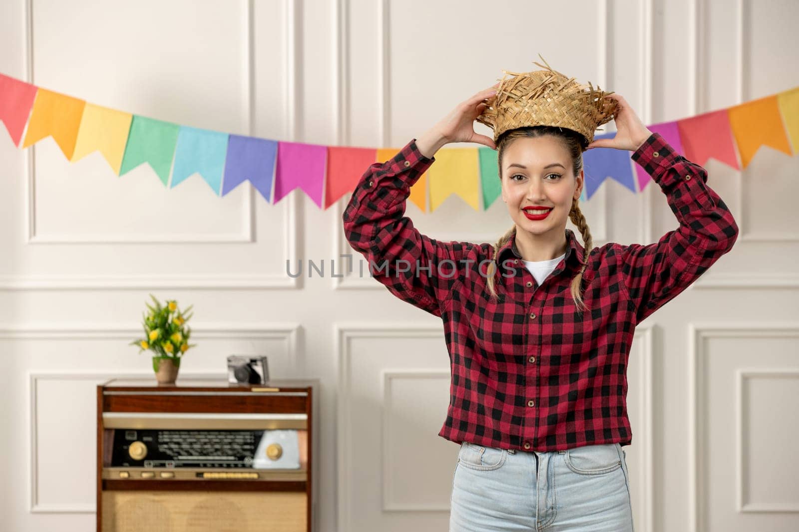 festa junina cute girl brazilian midsummer with retro radio colorful flags putting hat on by Kamran