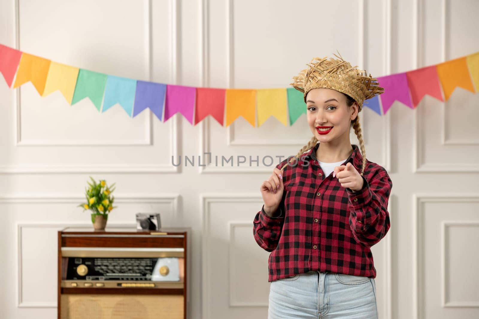 festa junina cute girl in straw hat brazilian midsummer with radio colorful flags pointing front