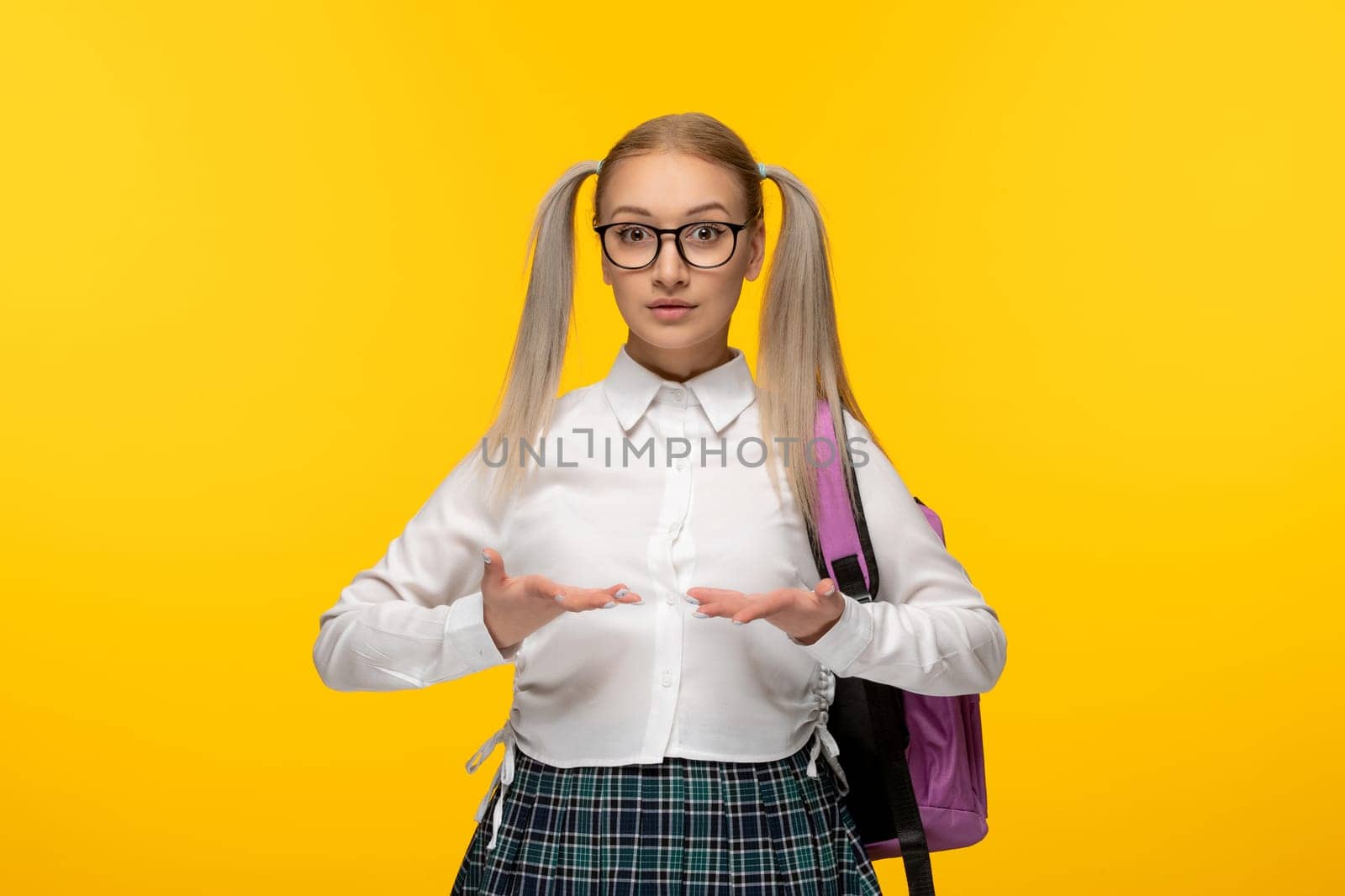 world book day blonde girl with pony tails in glasses