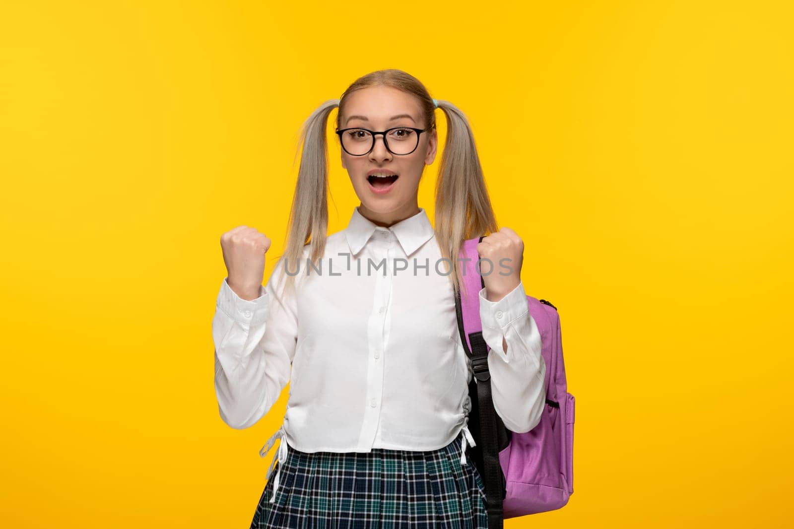 world book day blonde girl with ponytails and pink backpack in uniform by Kamran