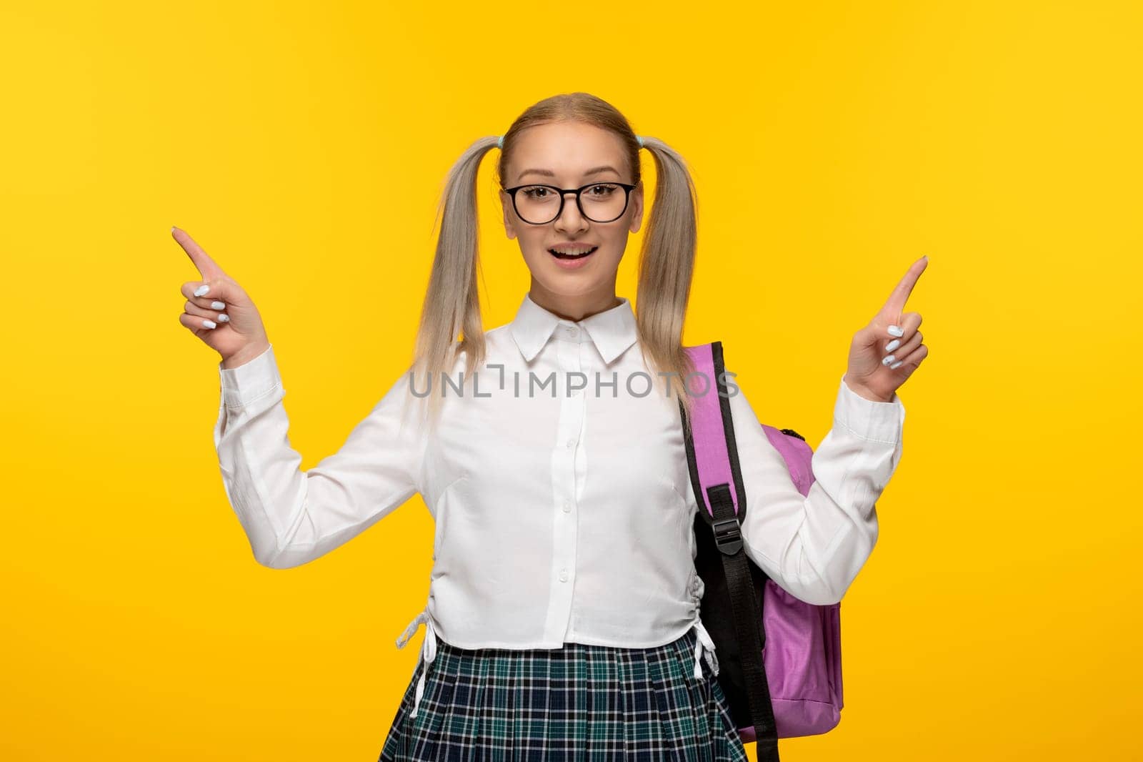 world book day blonde girl with ponytails wearing glasses with pink backpack