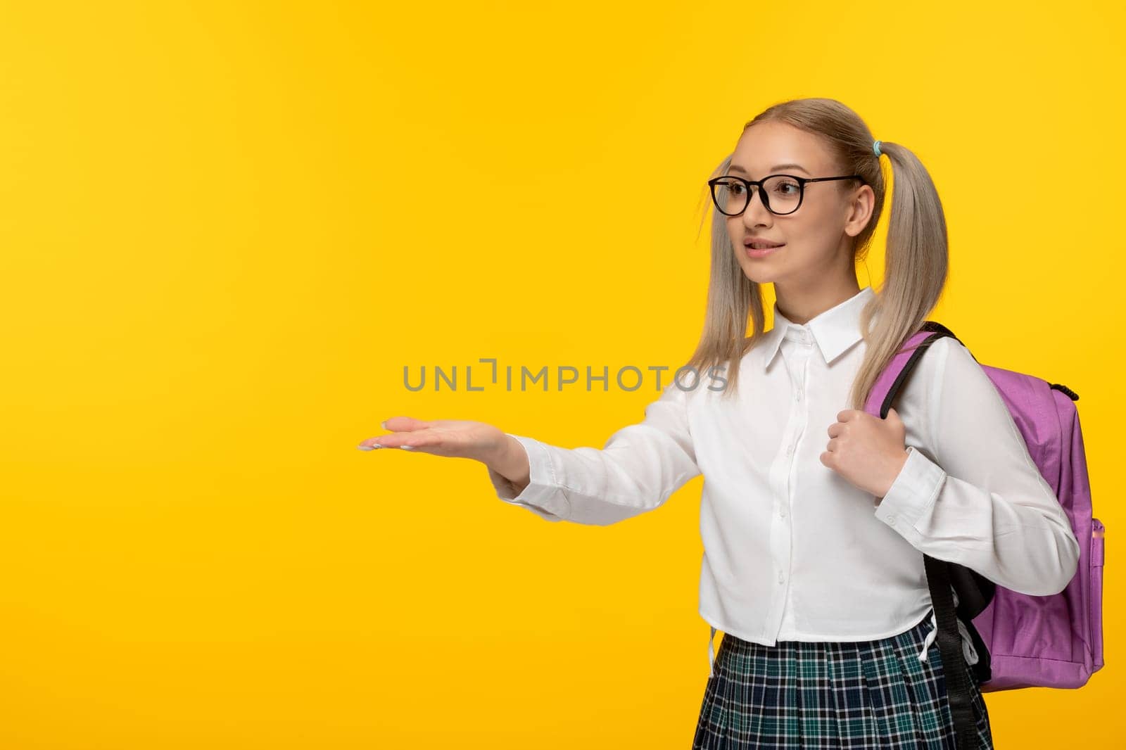 world book day girl with ponytails blonde pointing left in glasses by Kamran