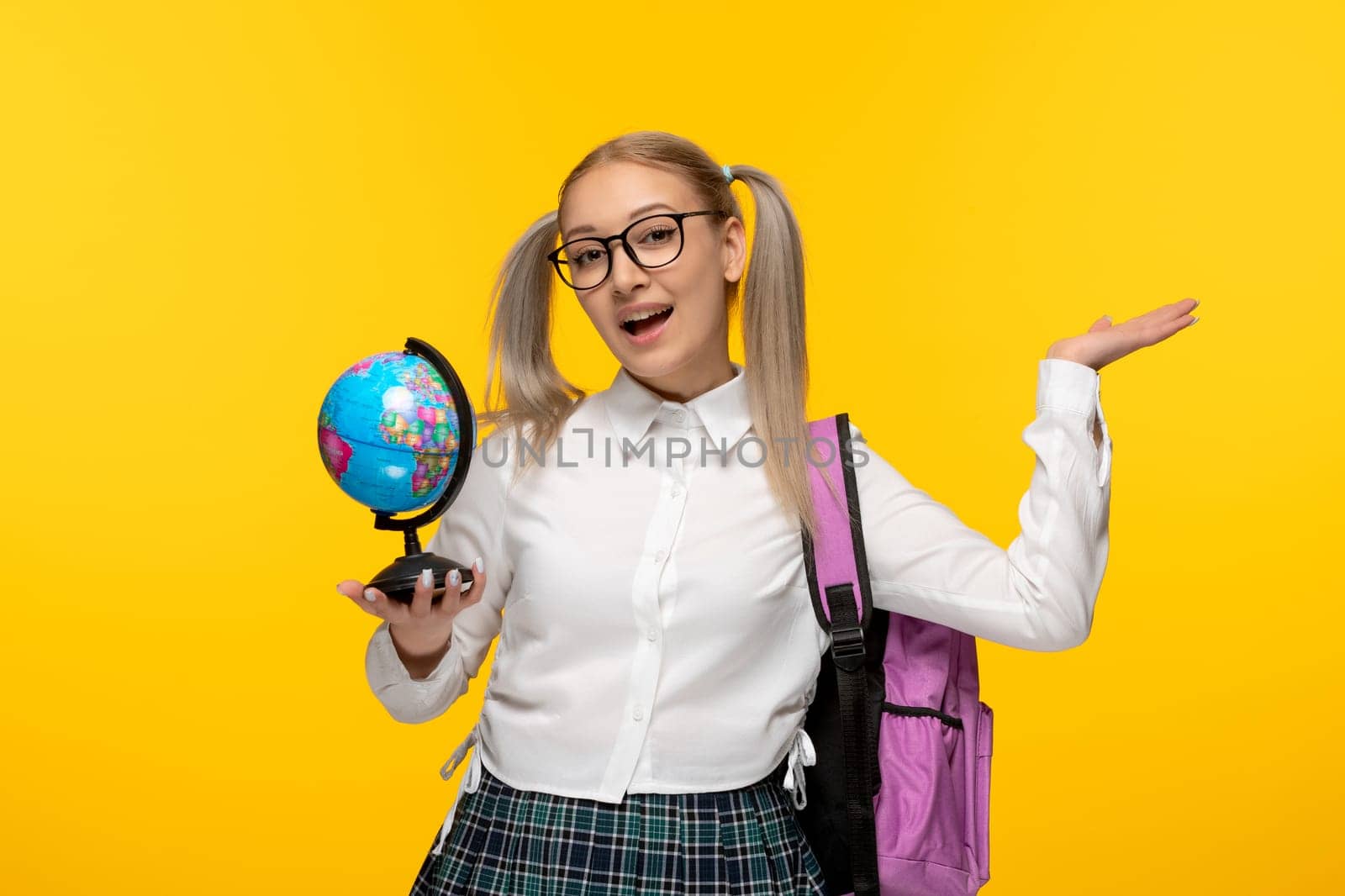 world book day happy cheering blonde schoolgirl with the blue globus by Kamran