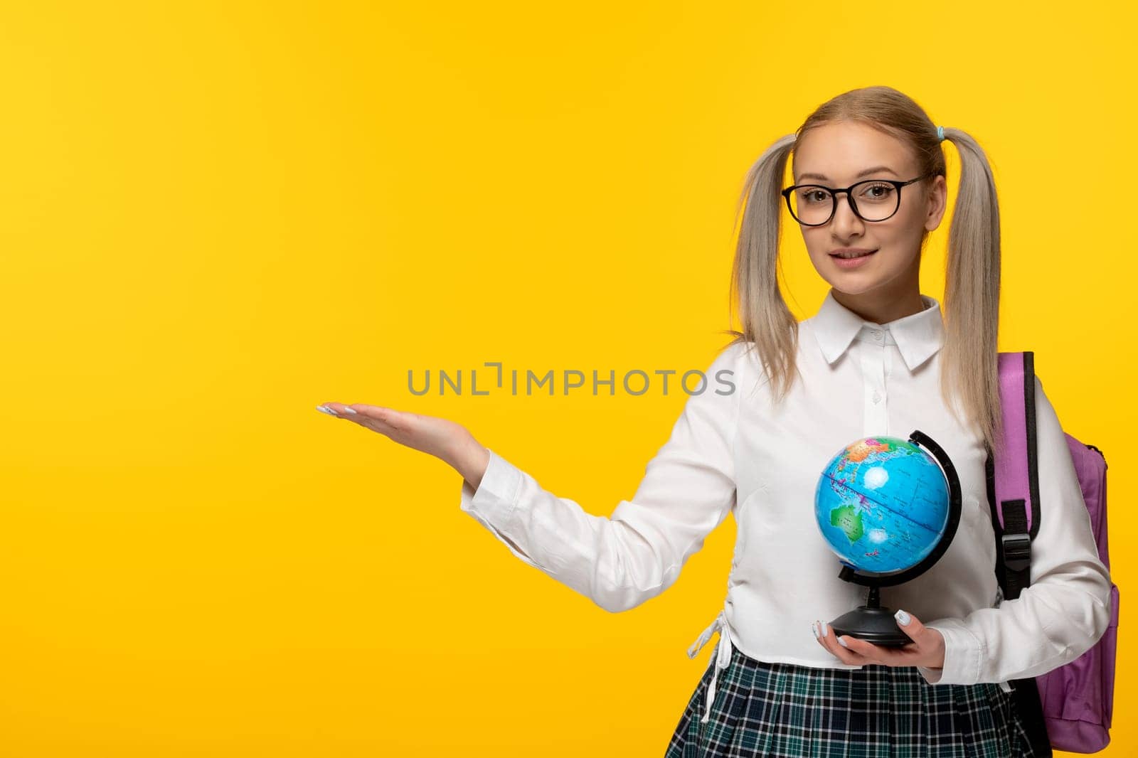 world book day happy smiling school girl in cute uniform with blue globus by Kamran