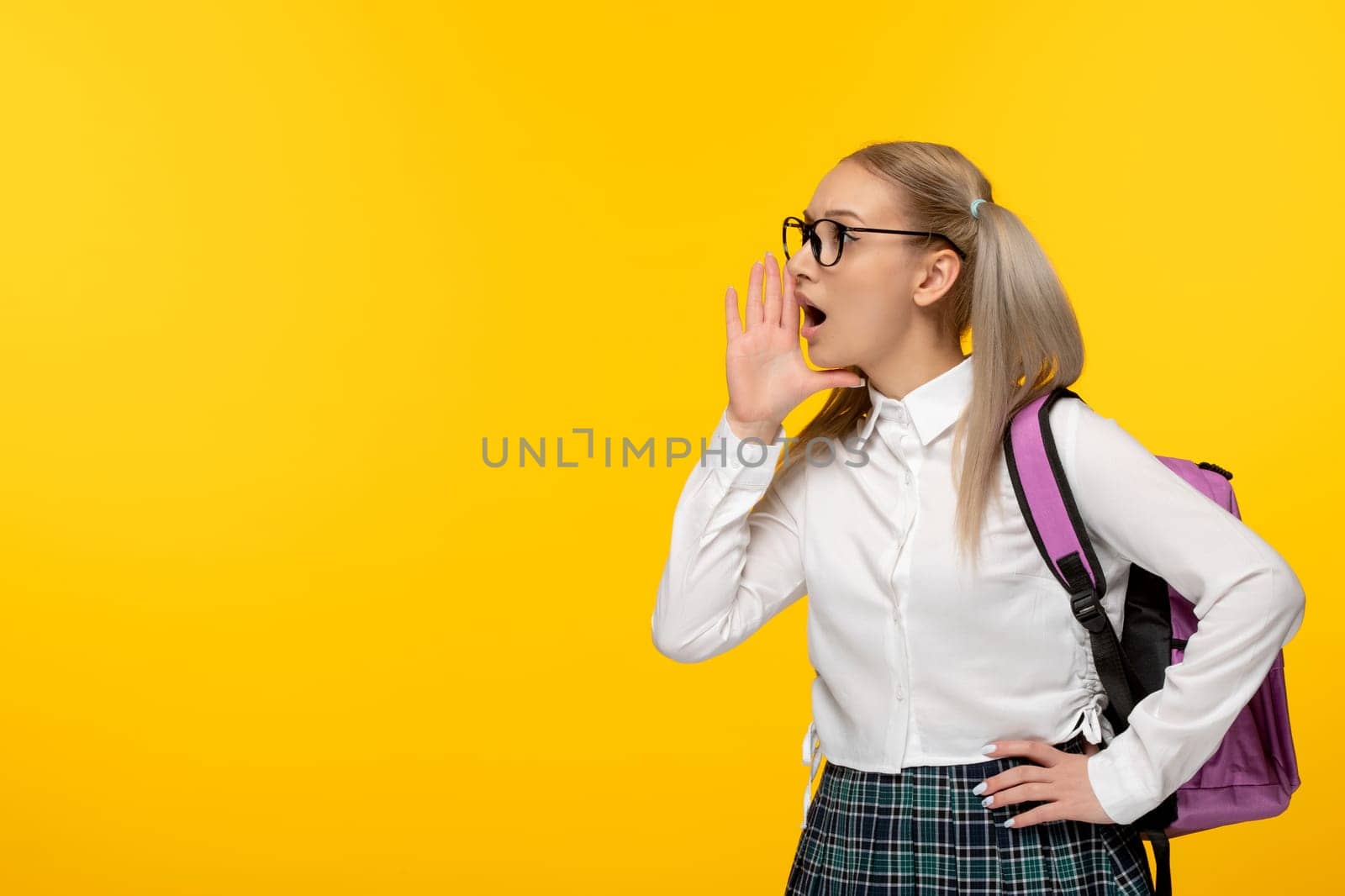 world book day school girl in cute uniform calling for help in glasses