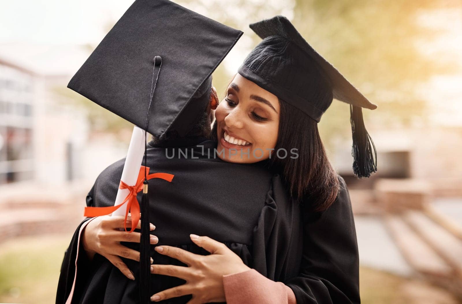 Hug, students and graduation at college for women with a diploma and support outdoor. Graduate celebration with friends happy for university achievement, education success and future at school event by YuriArcurs