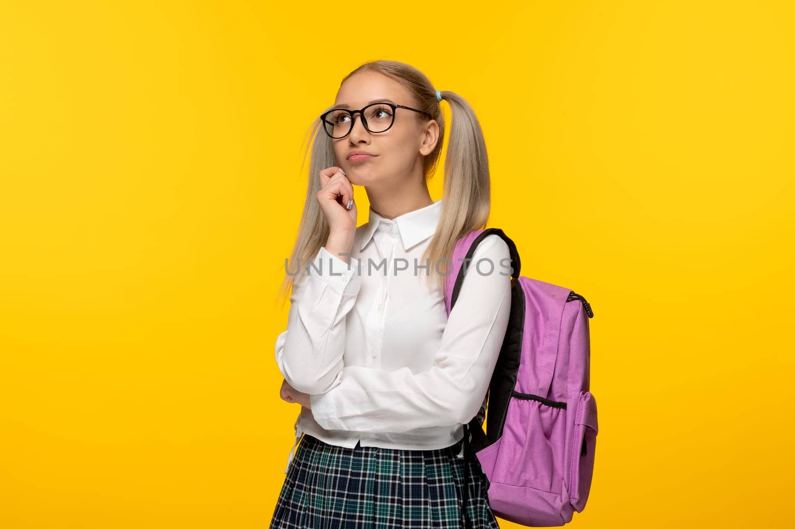 world book day thinking blonde schoolgirl in glasses and pink backpack by Kamran