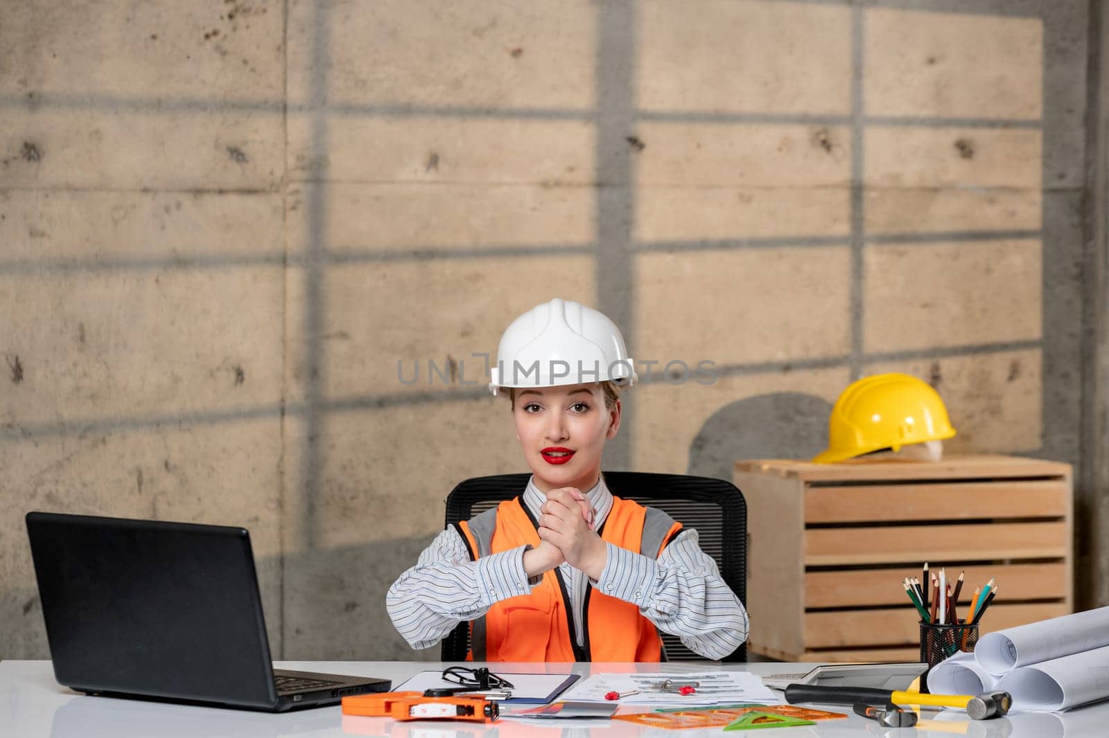 engineer smart young cute blonde girl civil worker in helmet and vest creating new building by Kamran