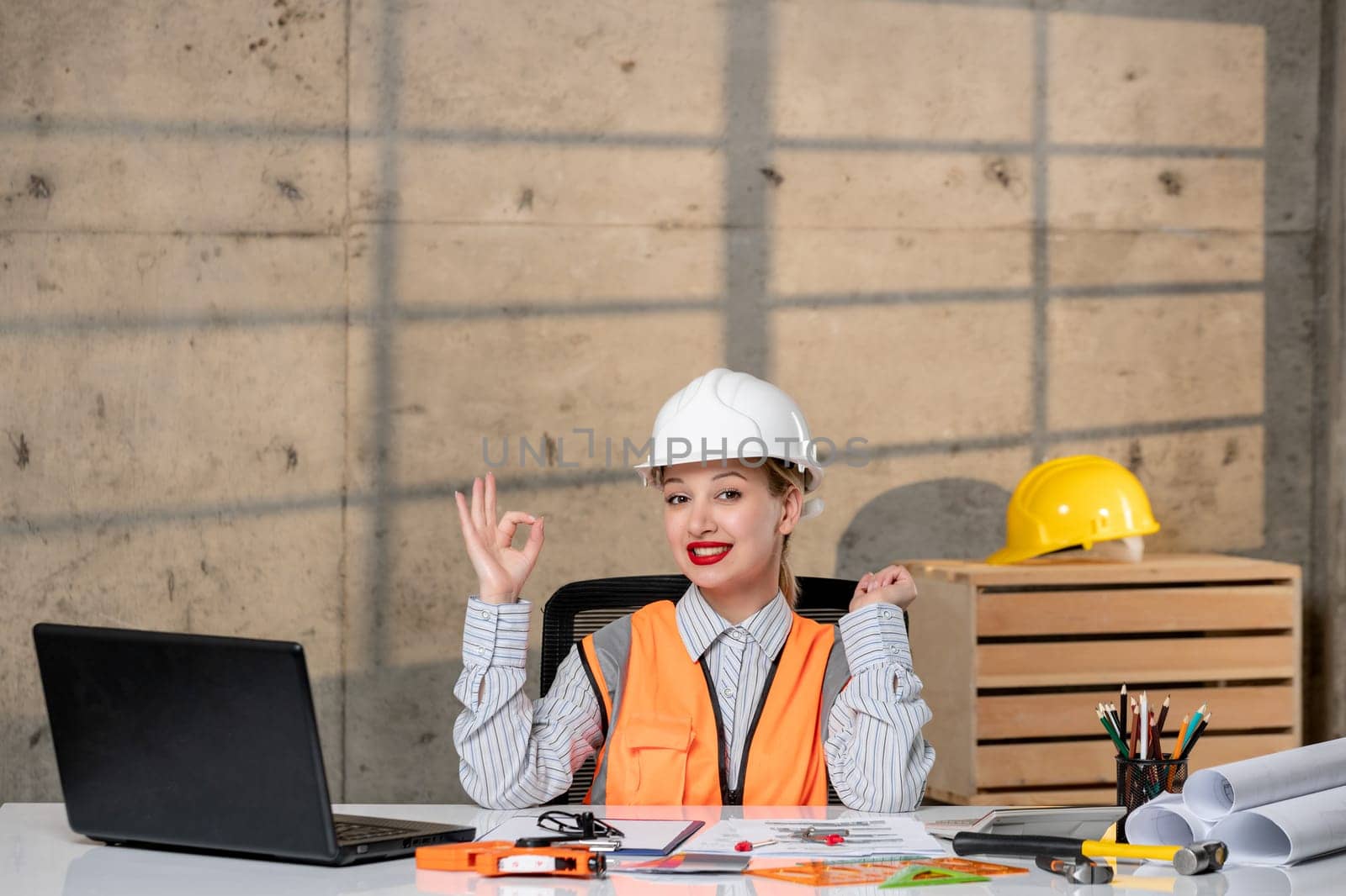 engineer smart young cute blonde girl civil worker in helmet and vest happy for new building
