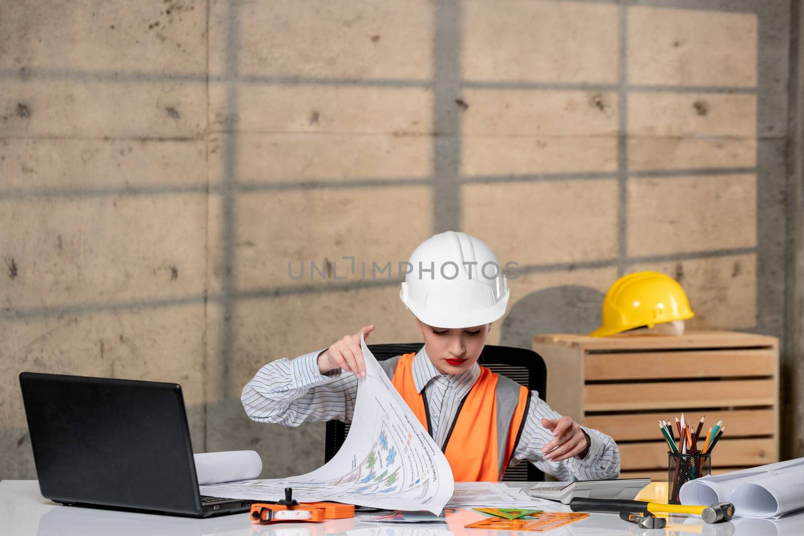 engineer smart young cute blonde girl civil worker in helmet and vest with new project