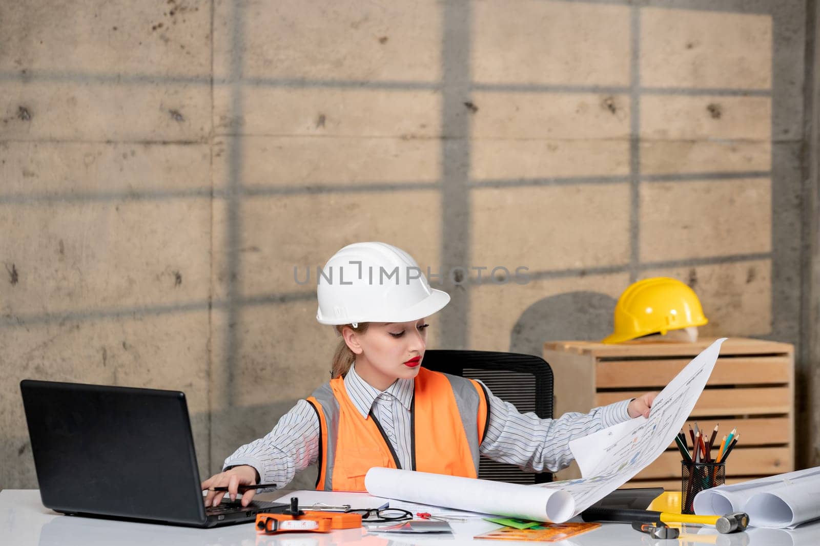 engineer smart young cute blonde girl civil worker in helmet and vest with project by Kamran
