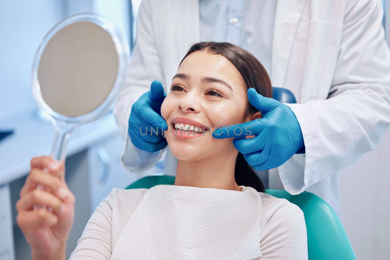 Dentist, mirror and woman with smile after consulting for teeth whitening, service and dental care. Healthcare, dentistry and female patient with orthodontist for oral hygiene, wellness and cleaning.