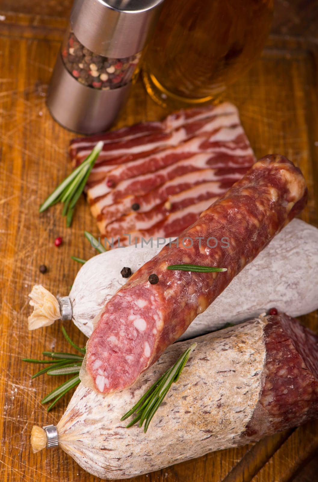 Smoked sausage with rosemary and peppercorns tomatoes and garlic by aprilphoto