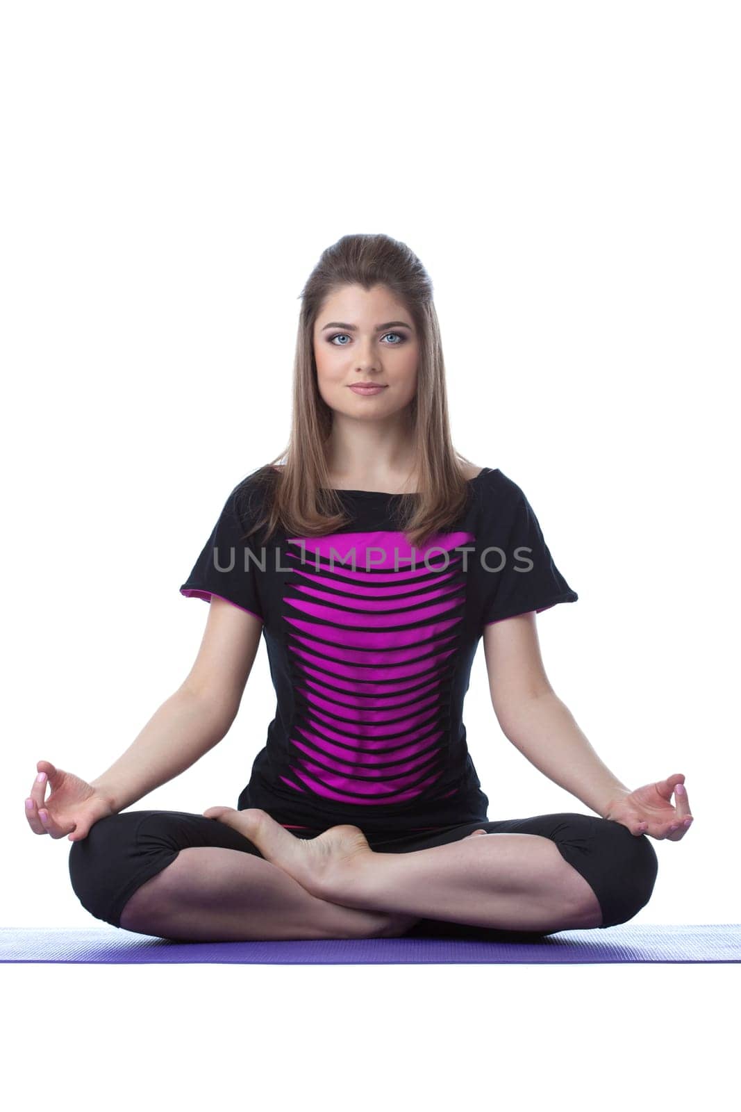 Image of attractive woman posing in lotus position, isolated on white