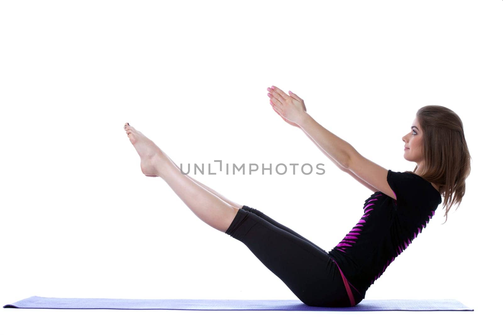 Smiling flexible yogi balancing in studio, isolated on white