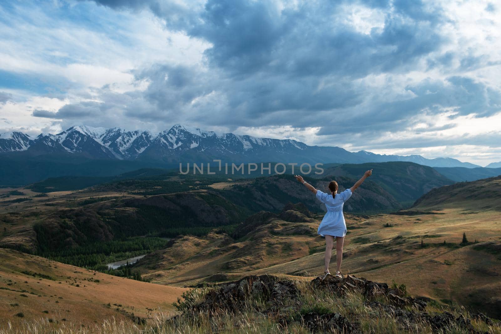 Woman in blue dress in summer Altai mountains by rusak