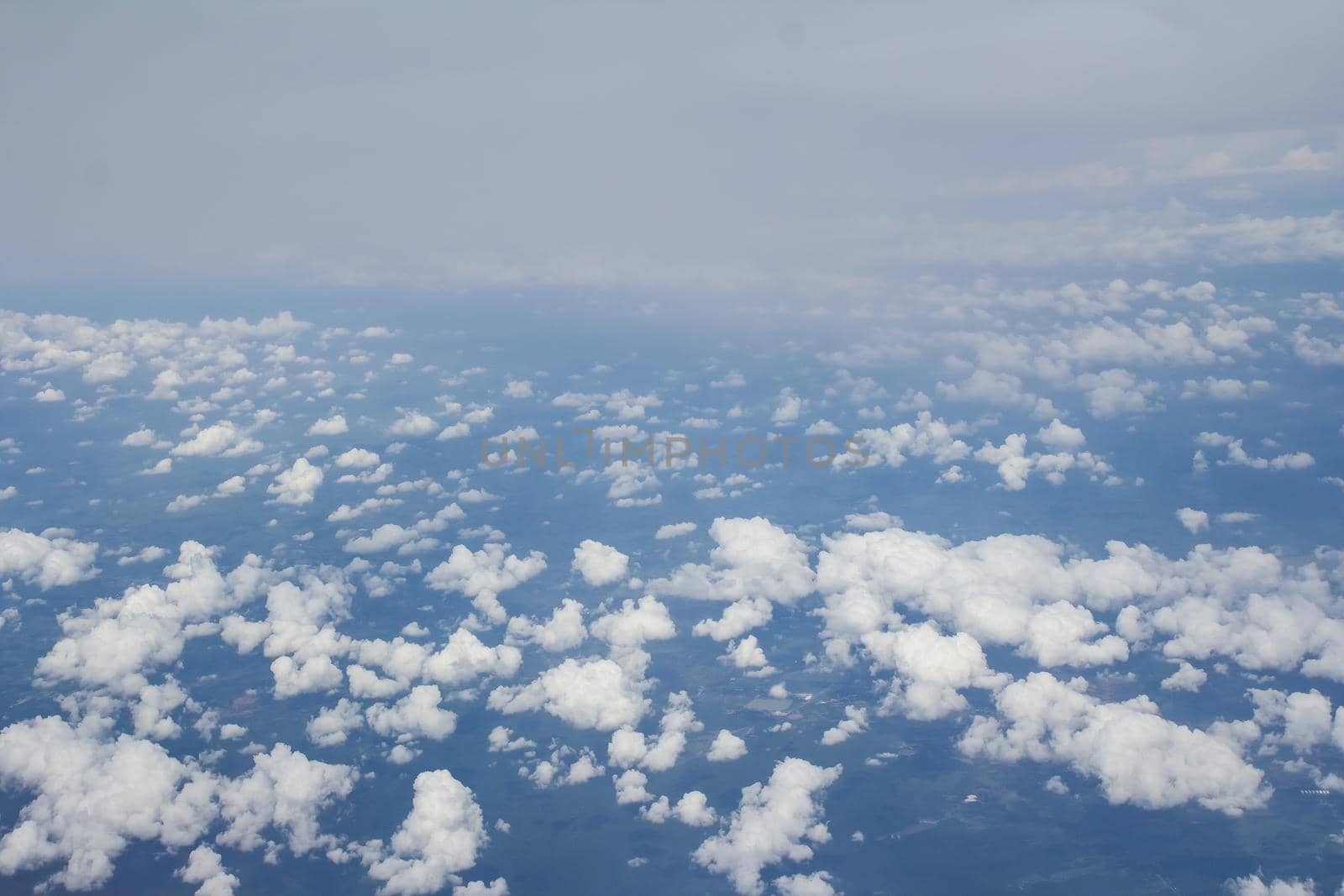 view from airplane, blue sky and white clouds by Wmpix