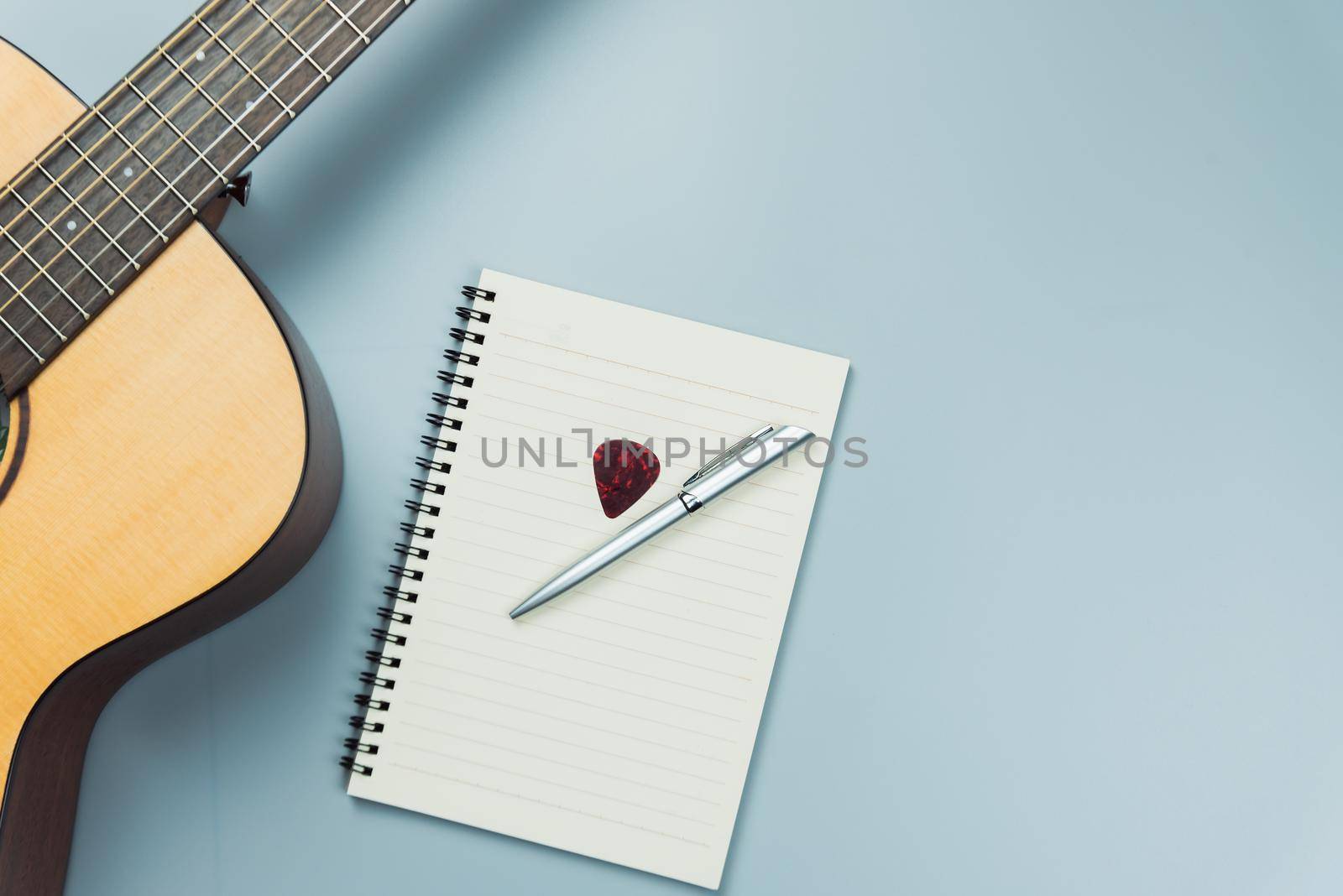 top view guitar and note book and headphone, music concept