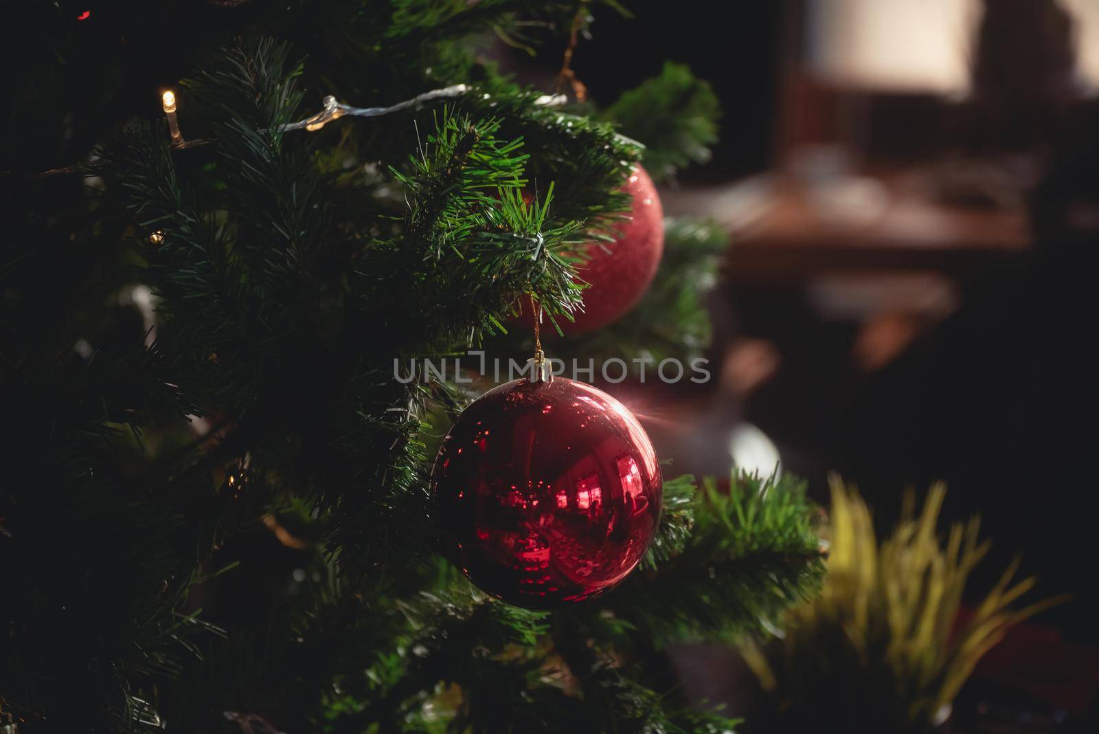 Christmas tree decoration bokeh lighting in the cafe by Wmpix