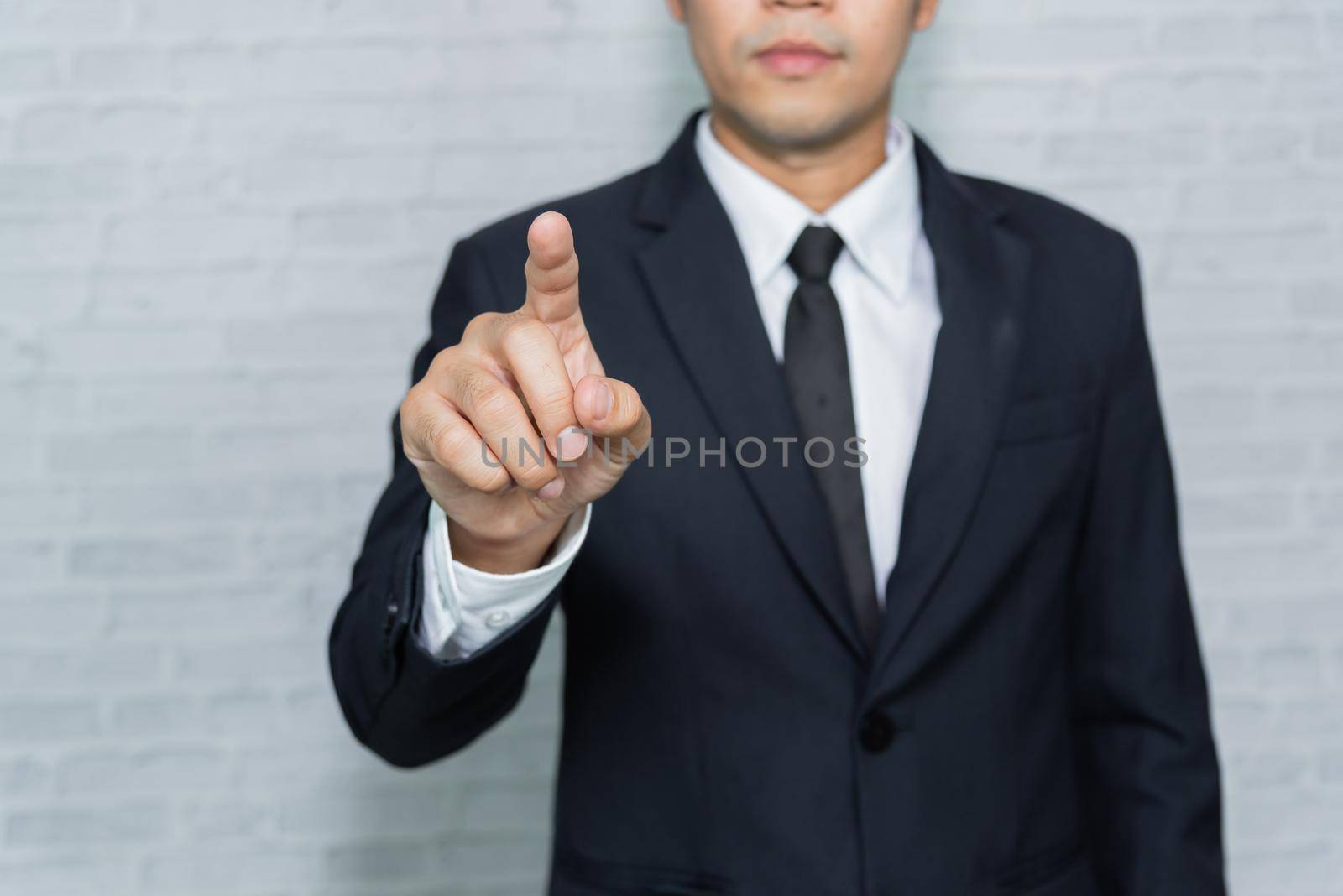 Businessman point by forefinger on something. copy-space