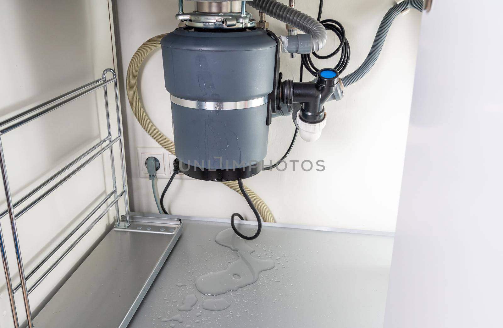 Waste disposal leak under sink, broken garbage chopper