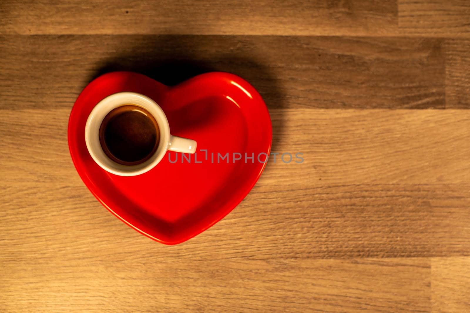 Valentine's Day heart saucer with cup of coffee by carfedeph