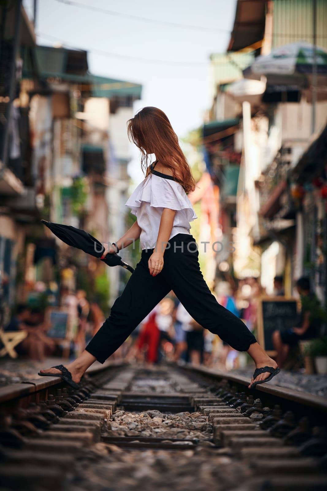 To travel is to live. a beautiful young woman exploring a foreign city. by YuriArcurs