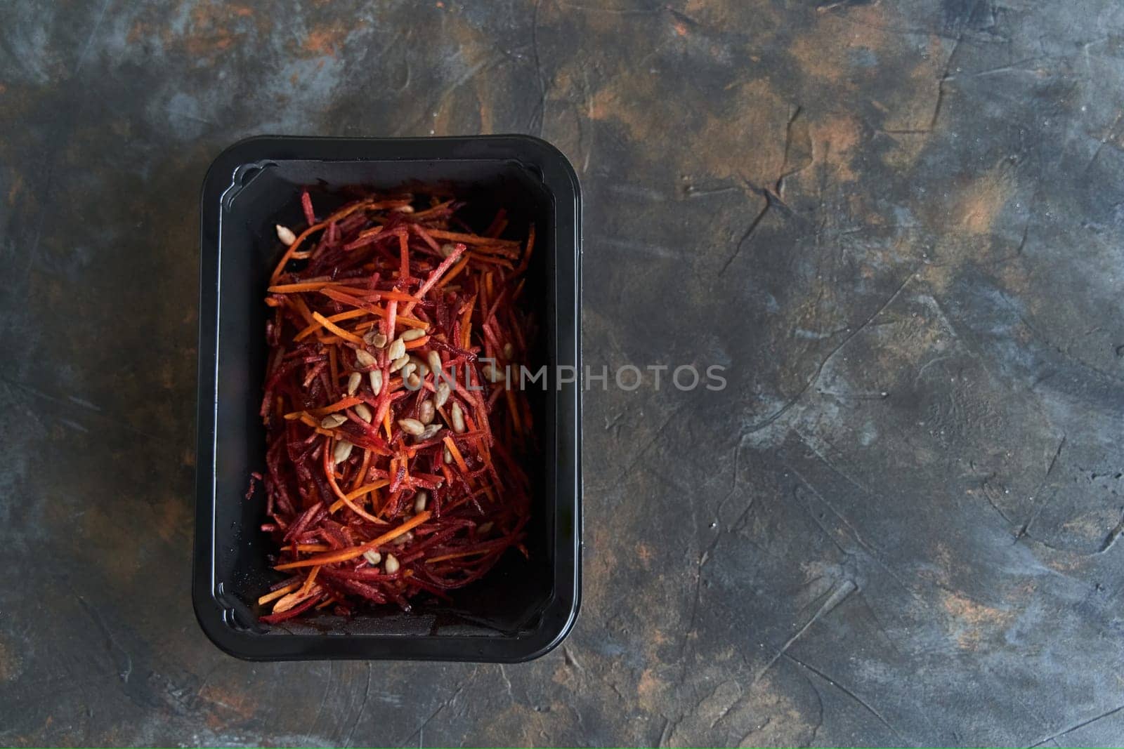 Dietary Salad with Beets and Carrots. Healthy diet. Diet for weight loss. Healthy food delivery in plastic containers. High quality photo