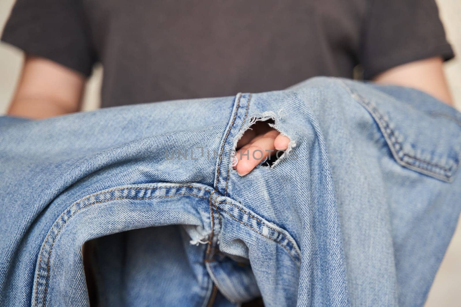 Jeans worn between the legs to the hole. by driver-s