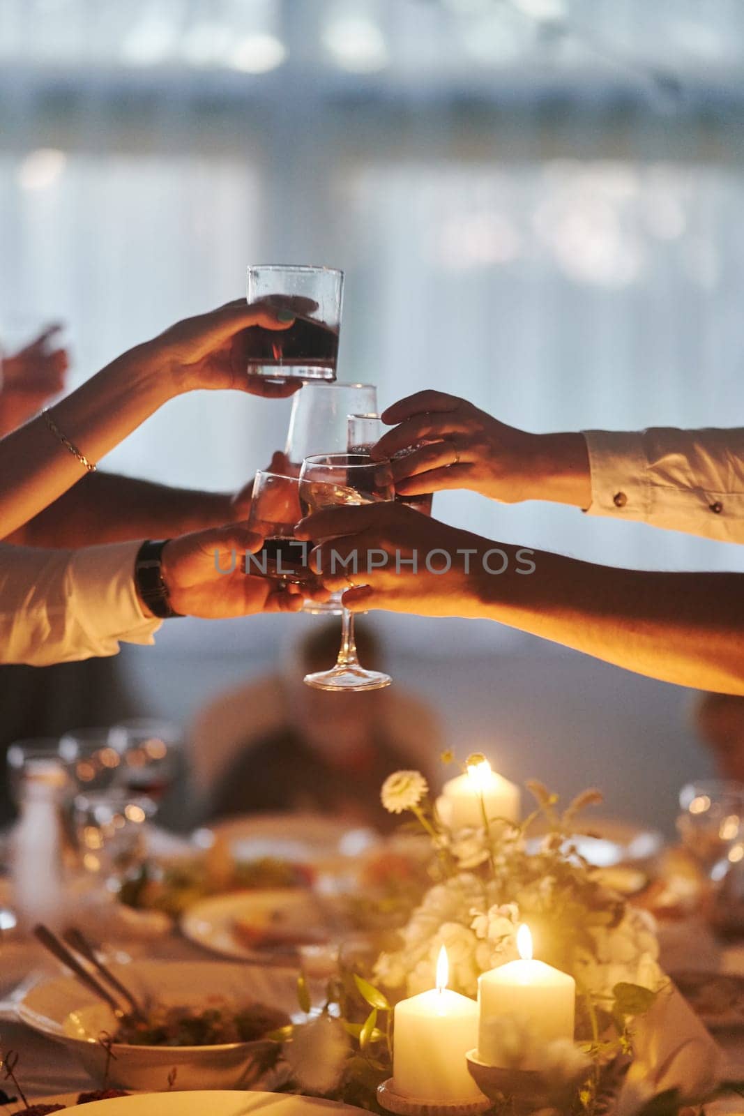 Clink glasses at a wedding celebration after saying congratulations. High quality photo