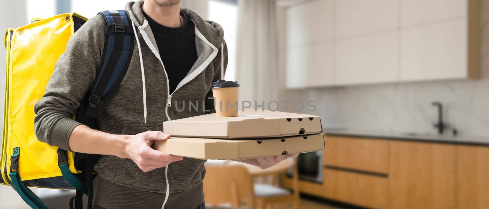 Delivery man with thermal backpack for food. Takeaway food delivery. Man delivering online food orders to customers with thermal bag, grocery deliver