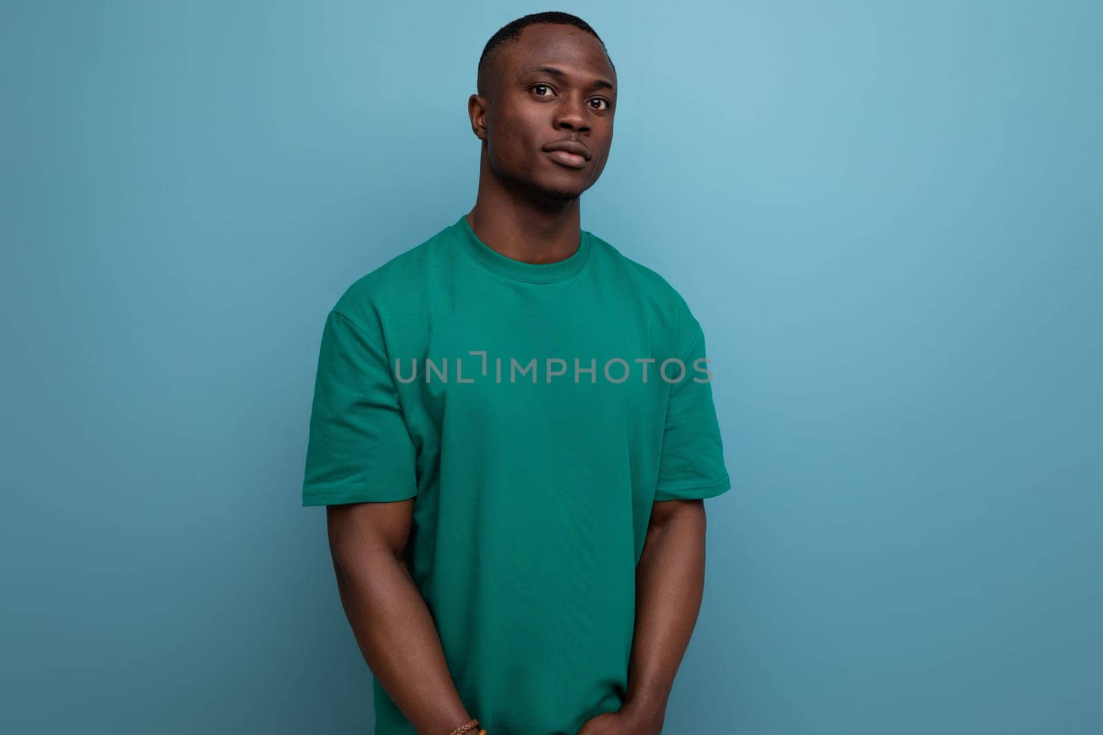 young successful handsome handsome american guy dressed in basic t-shirt isolated with copy space background by TRMK