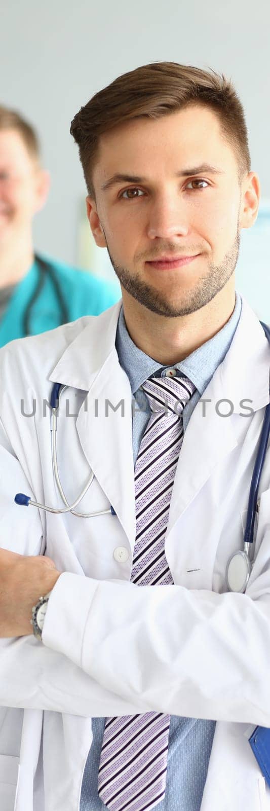 Medical team of doctors men looking at camera and smiling. Medical professional service and insurance concept