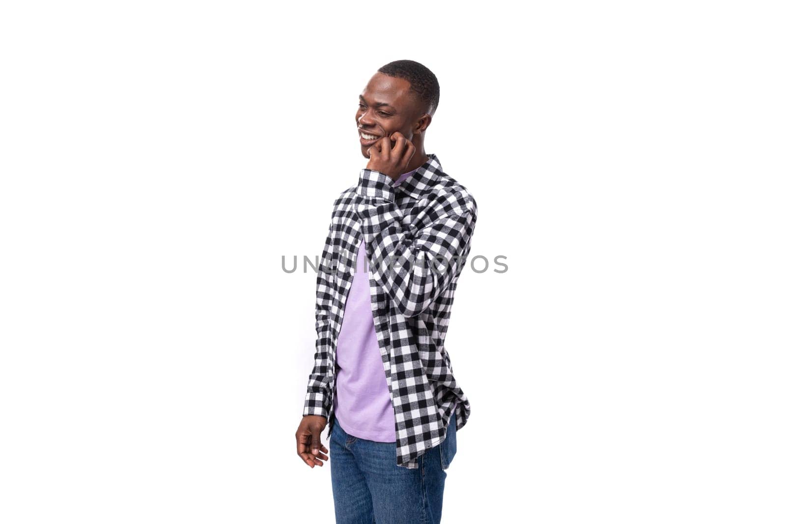 modest shy young american guy with short haircut dressed casually on white background with copy space.