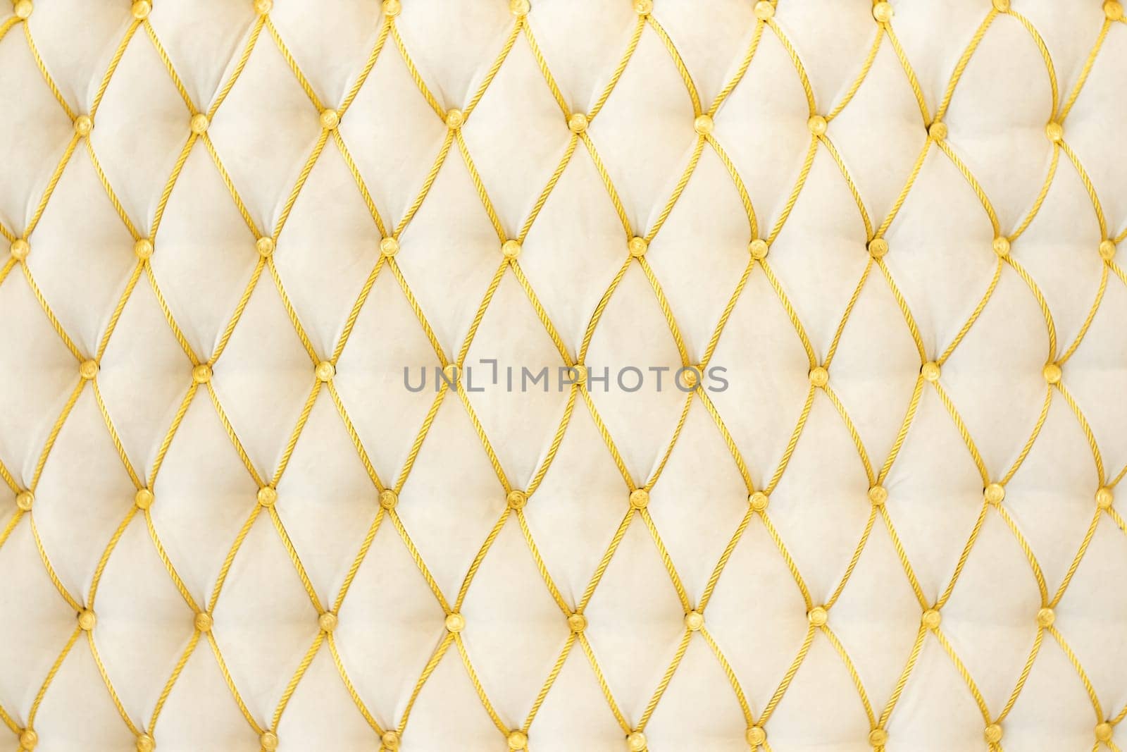 Background from classic furniture upholstery in white-yellow colors.