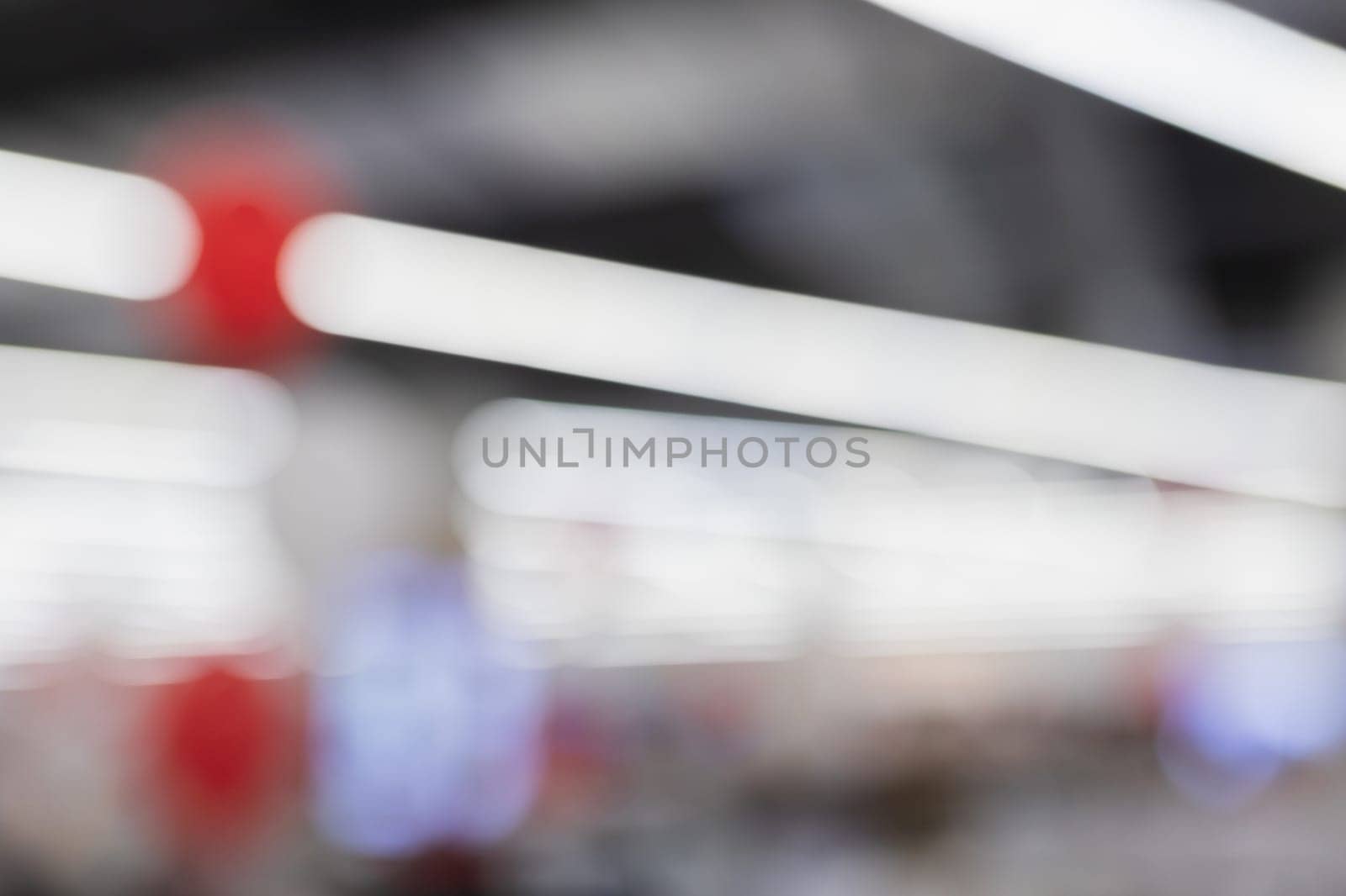 Background from a real photograph of the interior of a large shopping and entertainment center.