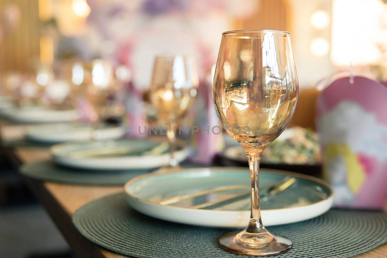 Table setting in a restaurant in rose gold warm colors.