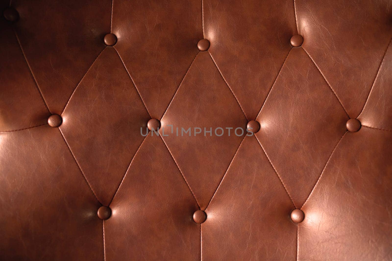 Brown leather texture with buttons for pattern or background by Rom4ek