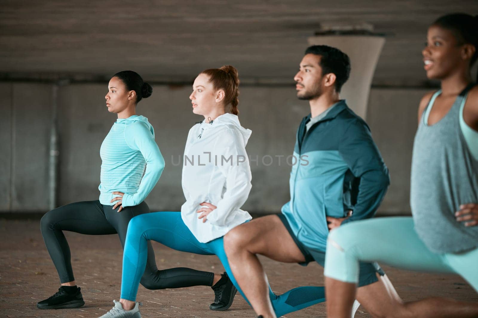 Friends, workout and people stretching as a fitness club for sports, health and wellness in an urban class together. Sport, commitment and group training or team doing pilates exercise in yoga by YuriArcurs