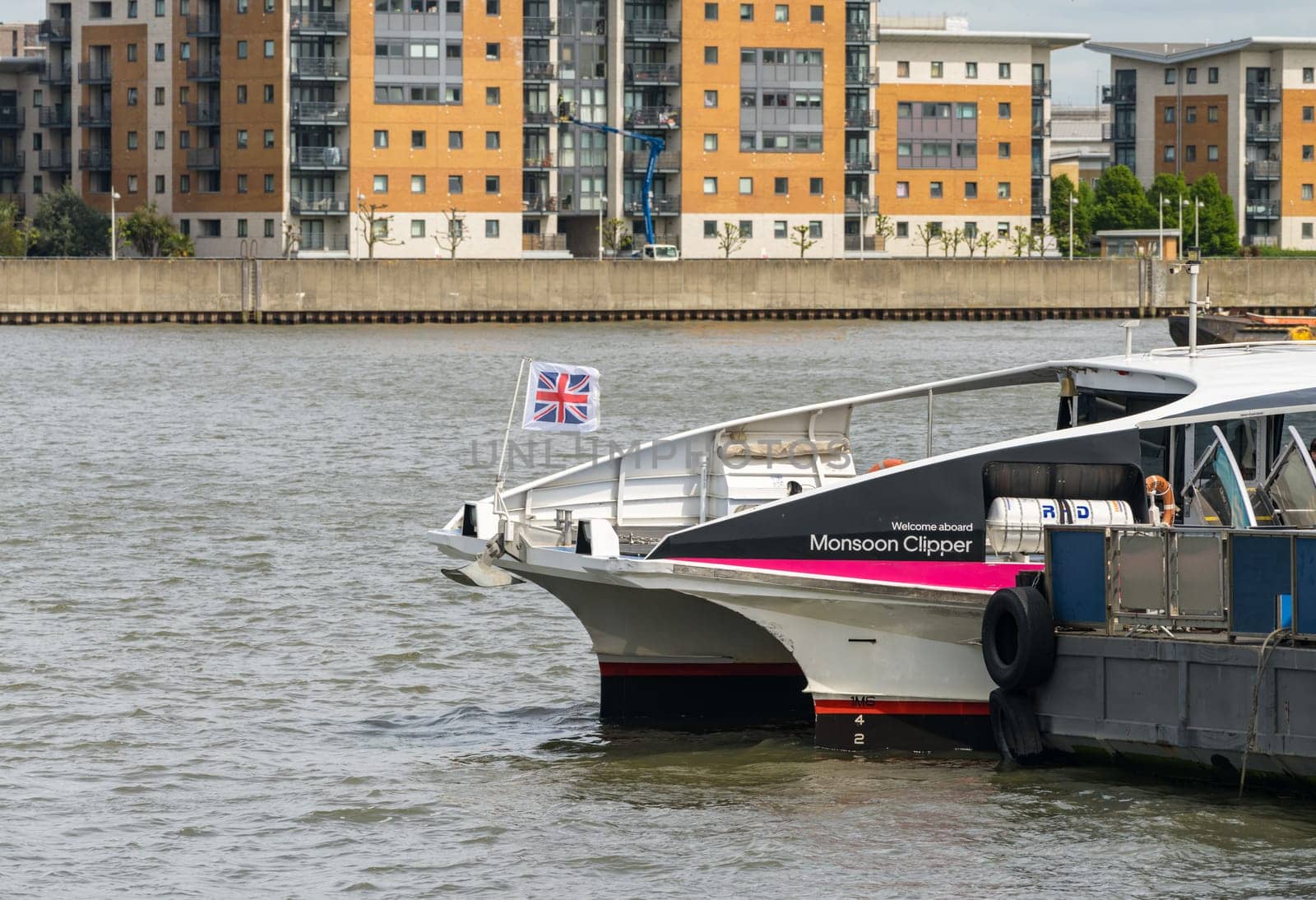 Uber boat docked at Woolwich Ferry terminal on river Thames by steheap