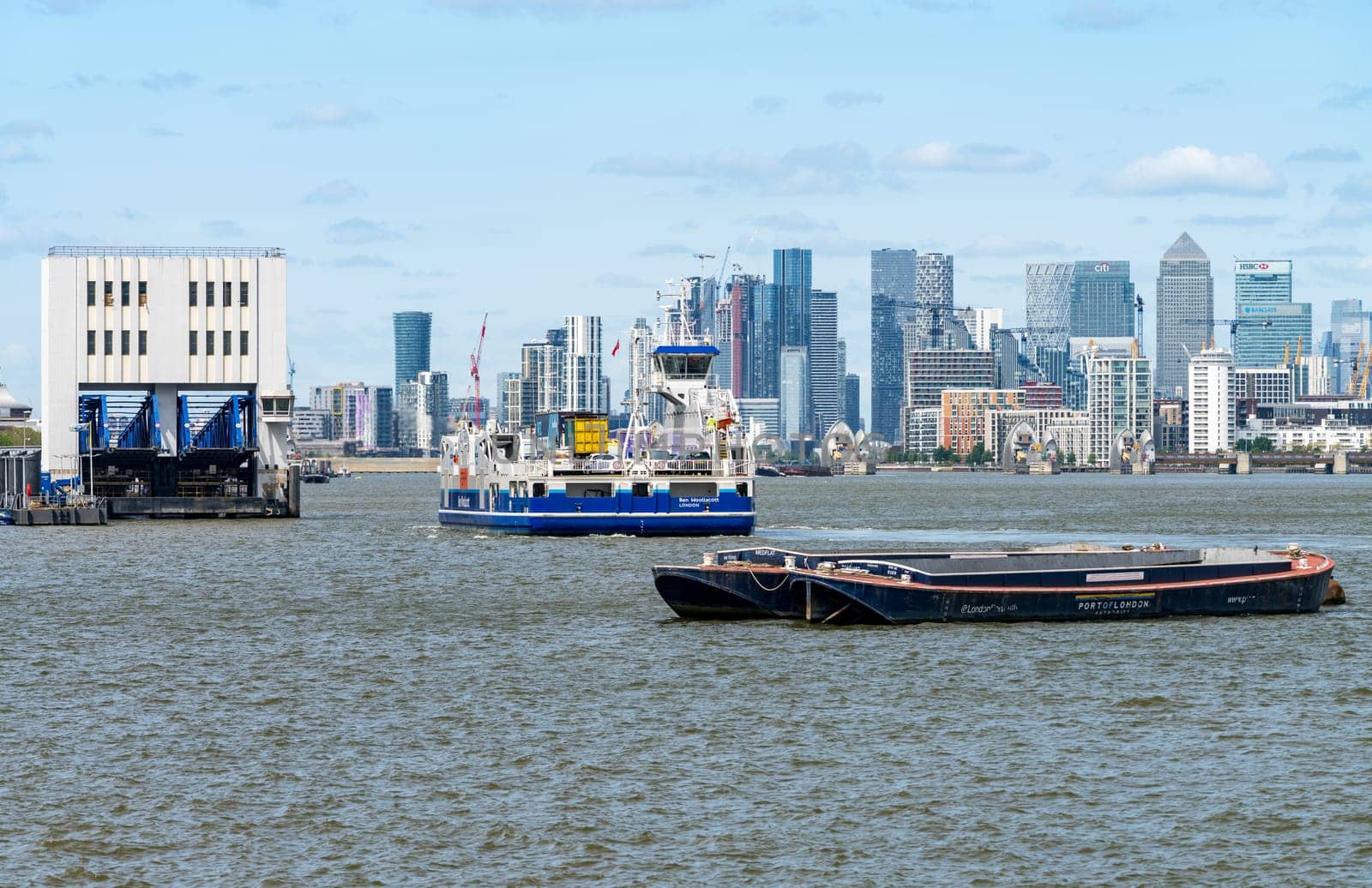 Woolwich, London - 15 May 2023: Car Ferry approaches Woolwich Ferry terminal on Thames