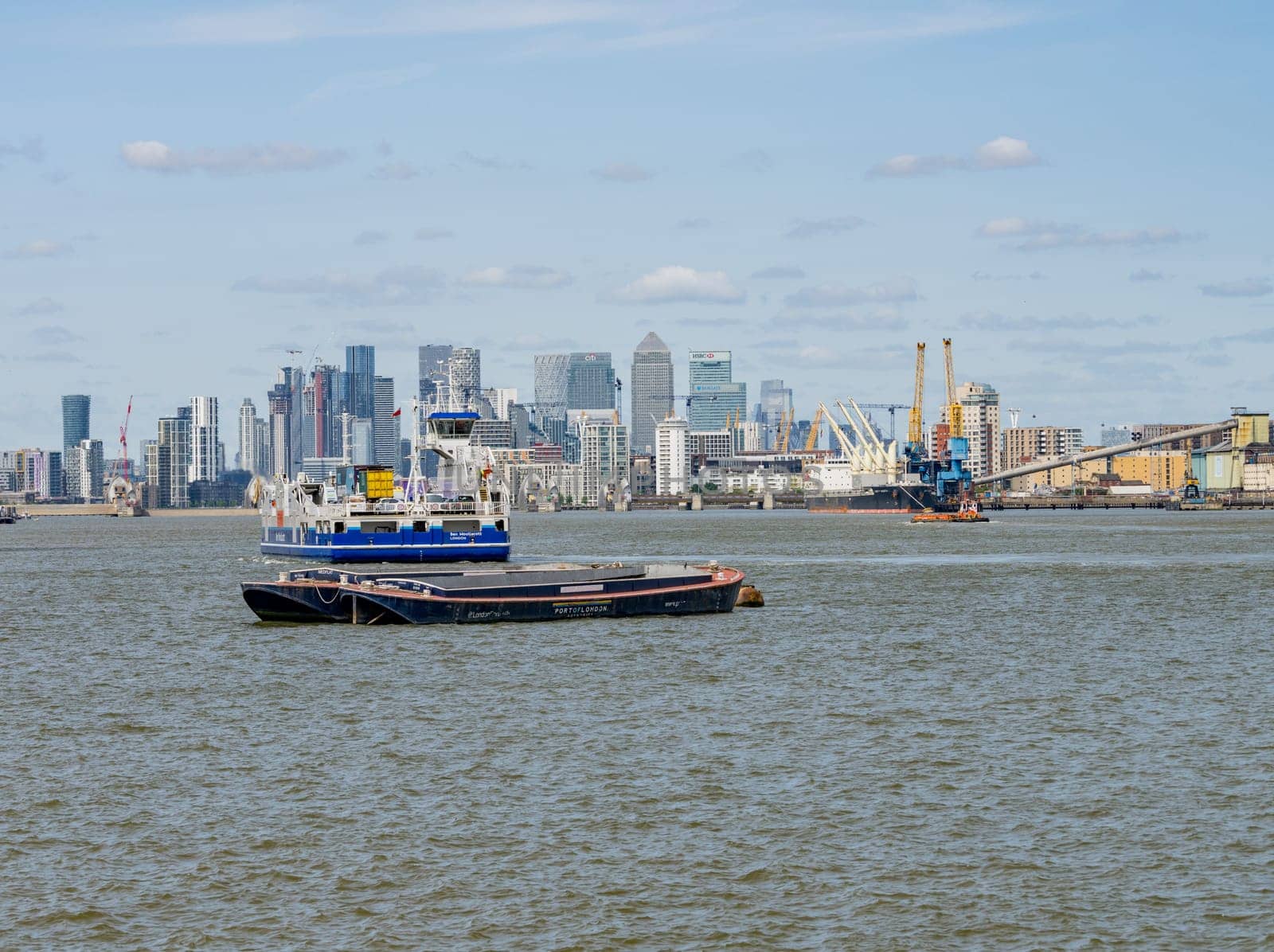 Car ferry approaches Woolwich Ferry terminal on river Thames by steheap